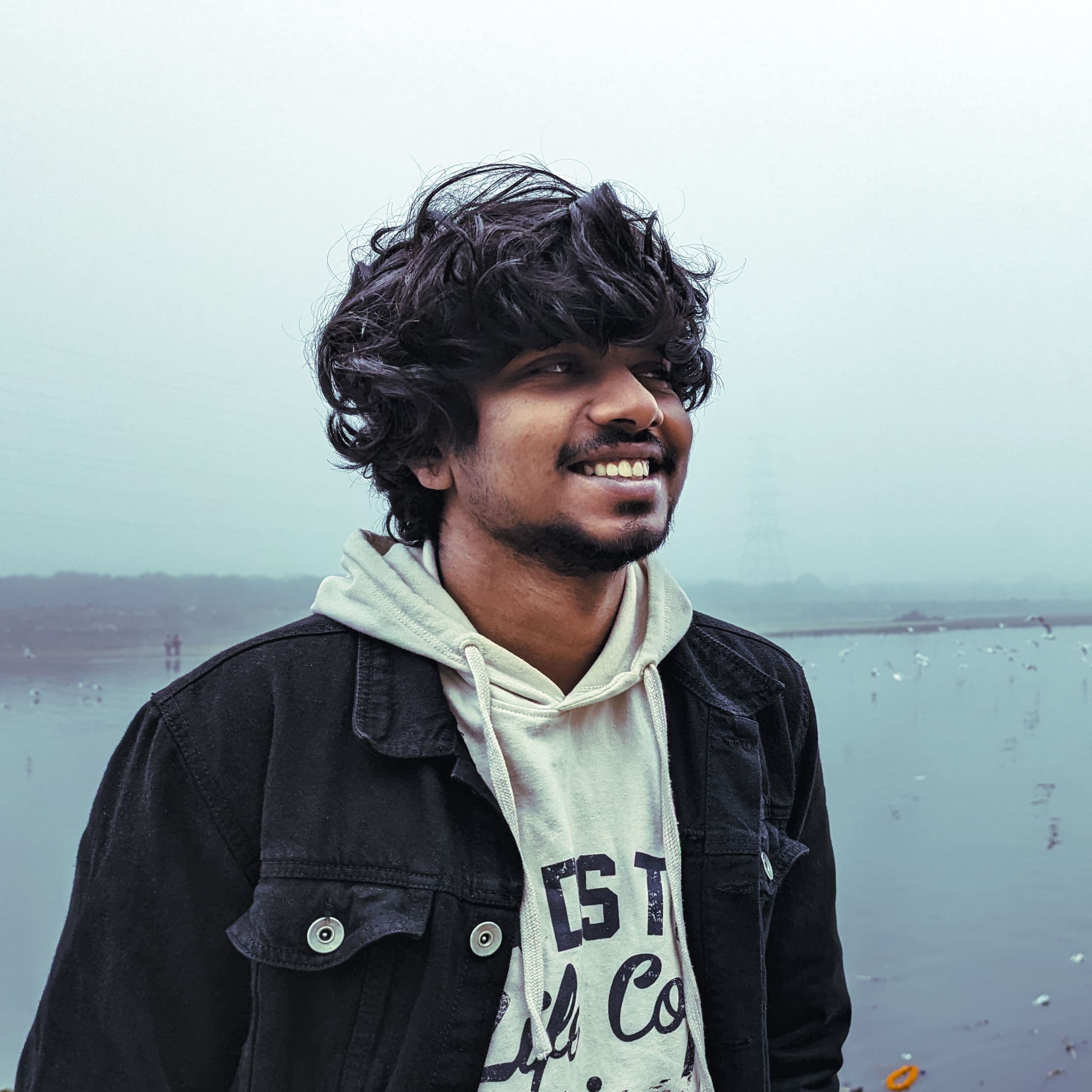 Headshot of Harigovind, the designer, smiling.